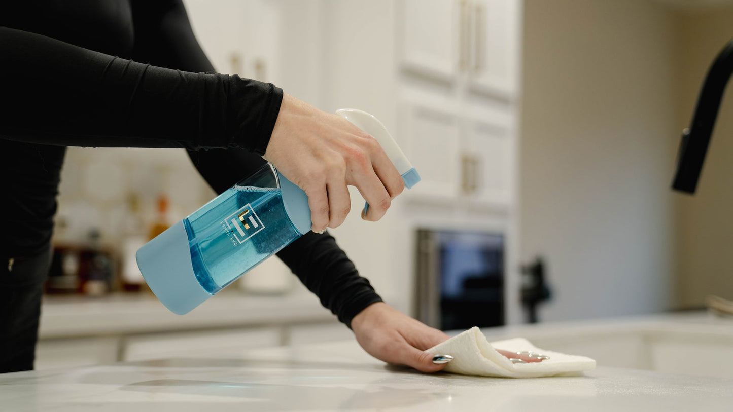Cleaning with ESNTL LVG reusable bottles and eco friendly cleaner